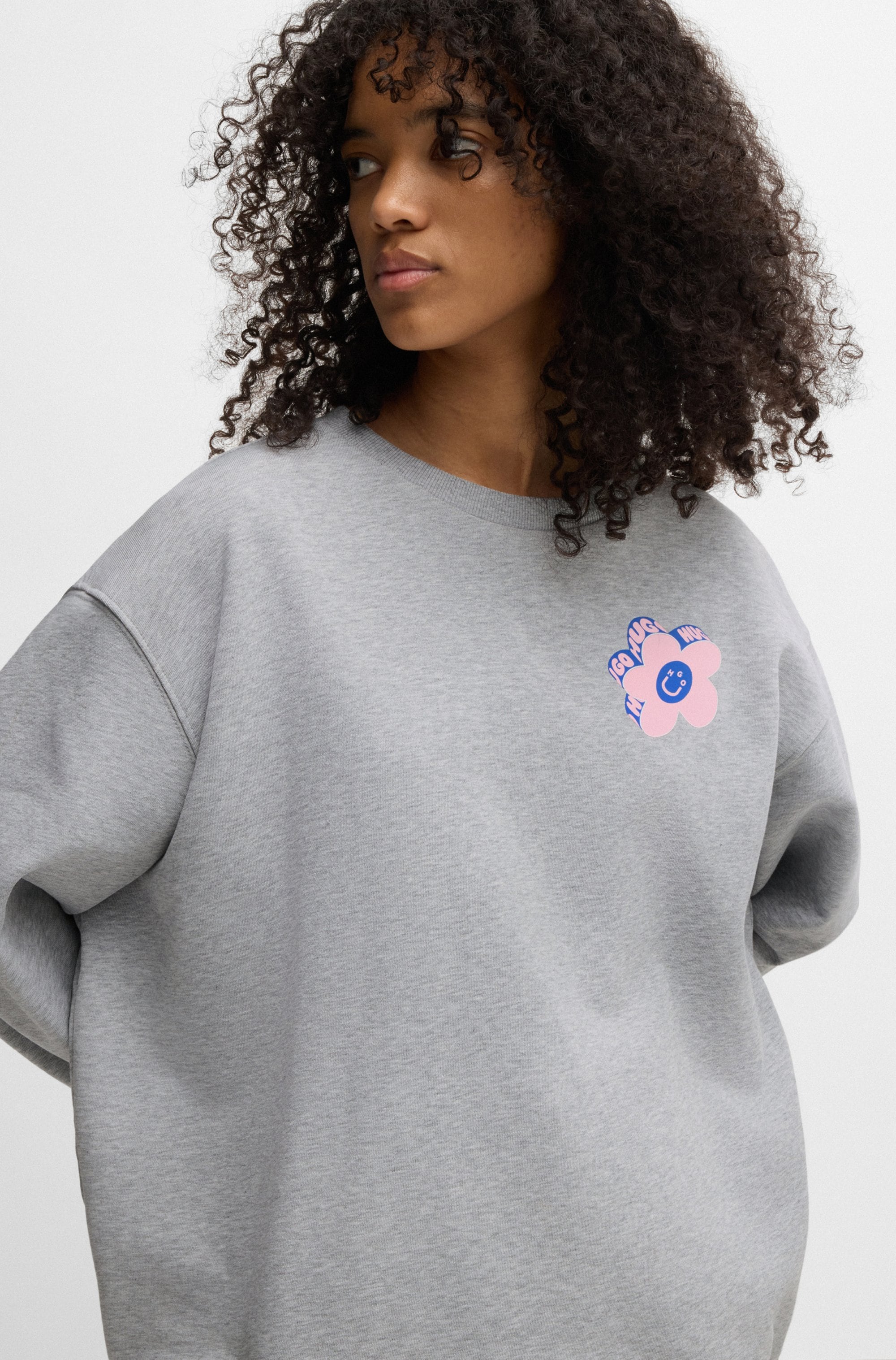 HUGO Blue Sweatshirt »Oversized Crew«, mit Flower Backprint, Straß Logo Print