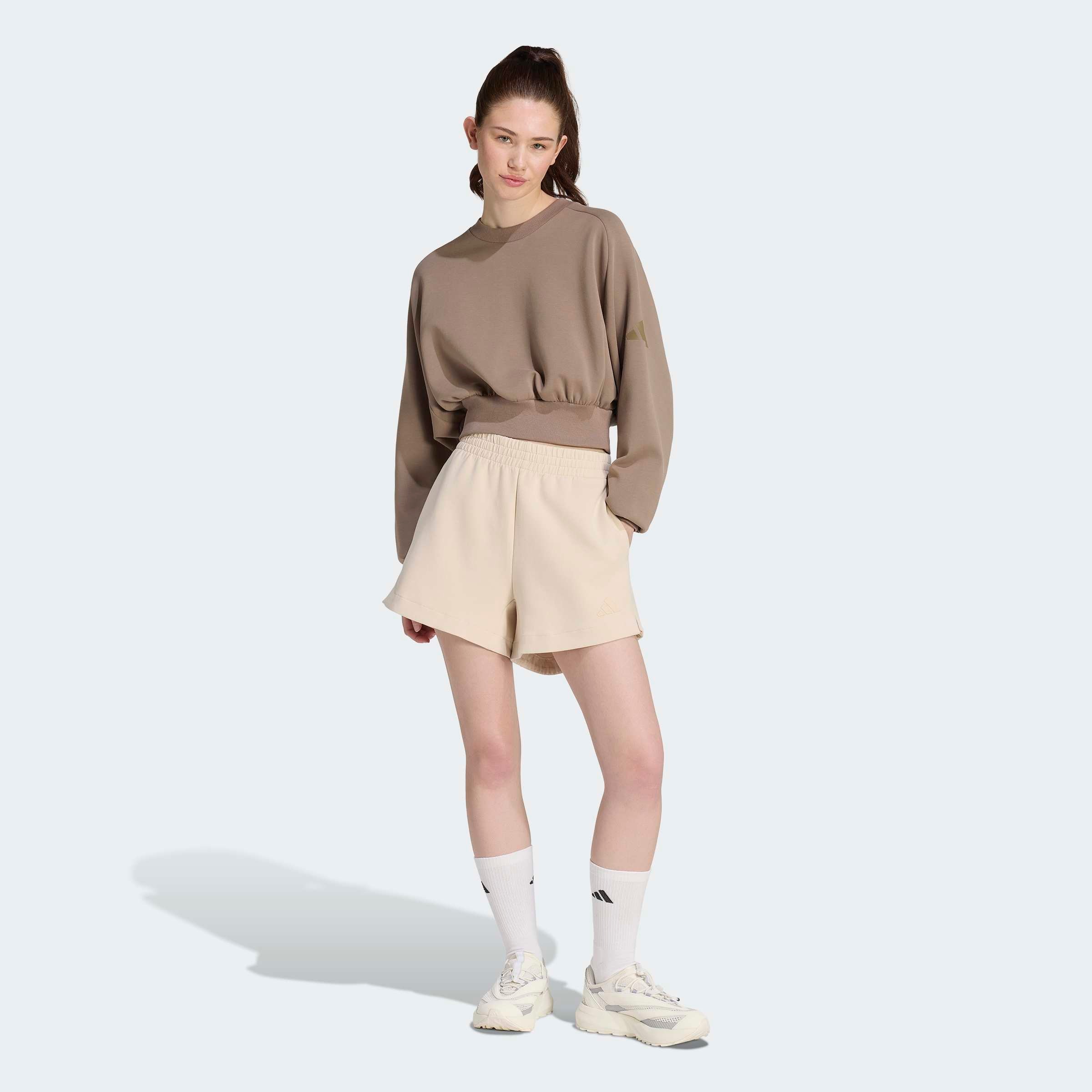 adidas Sportswear Sweatshirt »W ALL SZN SL SW«, mit angesetztem Bündchen, aus weichem, leichtem Material

