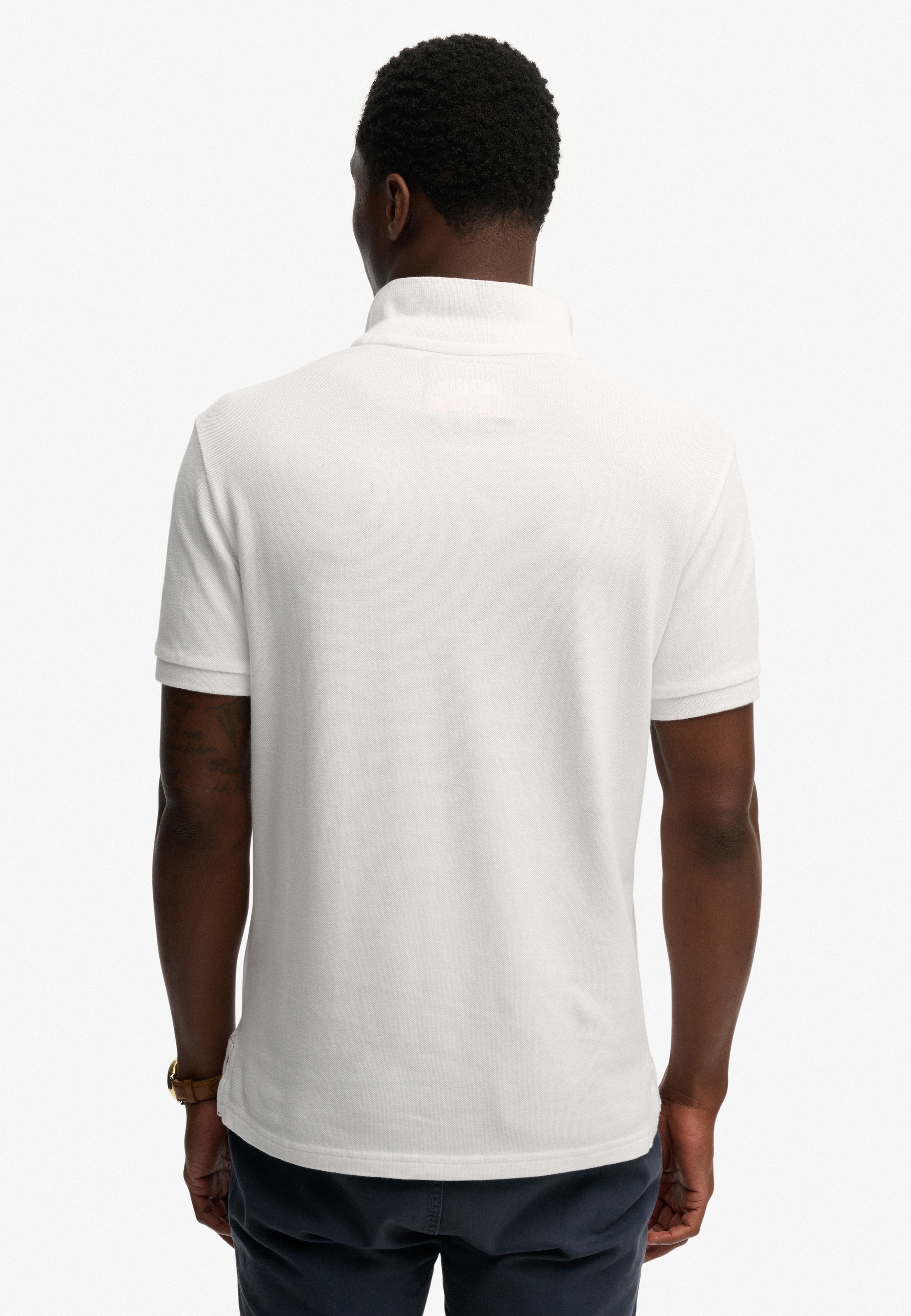Superdry Poloshirt »CREST POLO« mit Markenlabel, aus Baumwolle, Relaxed Fit, bedruckte Optik
