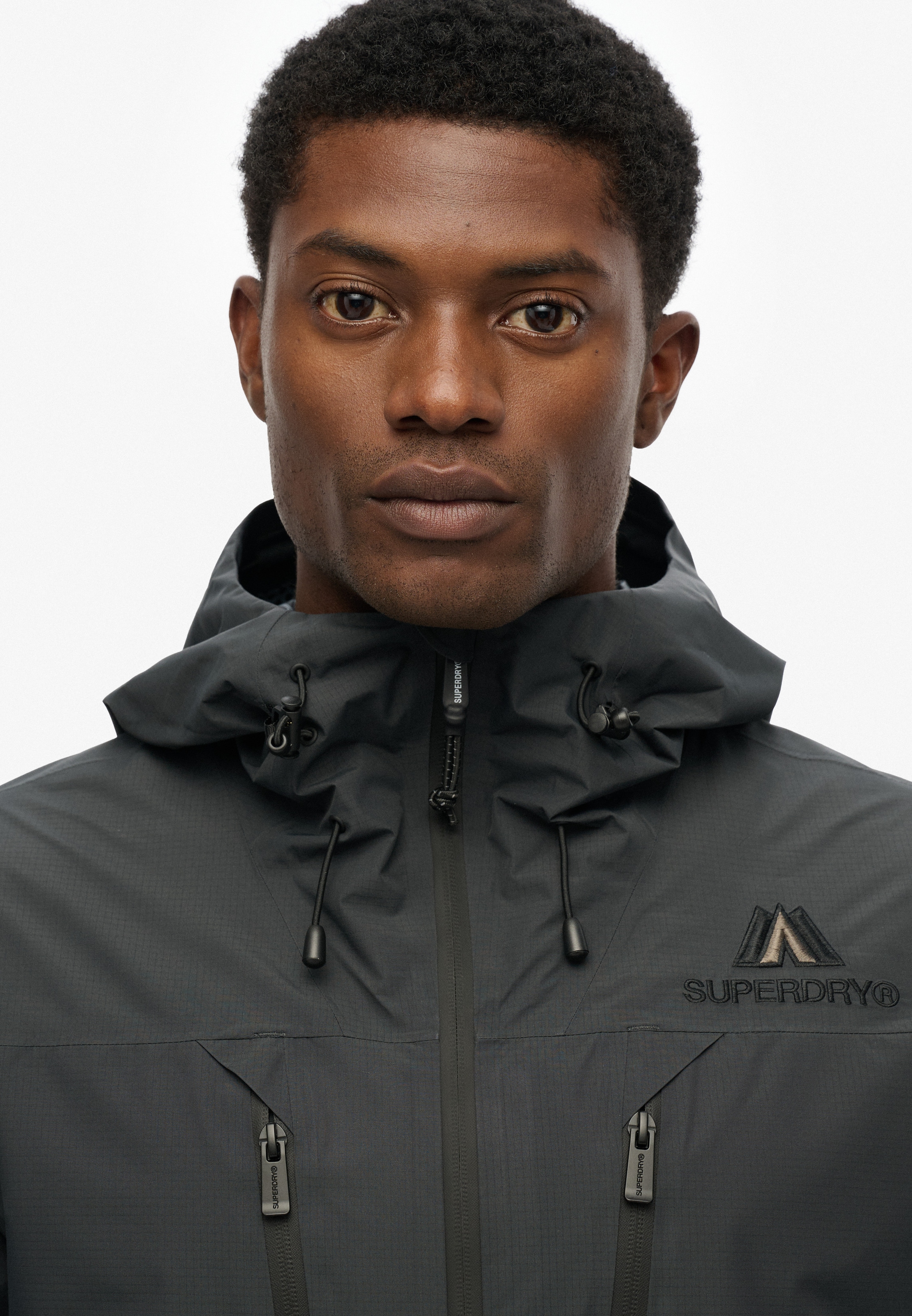 Superdry Outdoorjacke »WATERPROOF JACKET«, mit Kapuze, Wasserdicht (Säule wird nachgereicht)