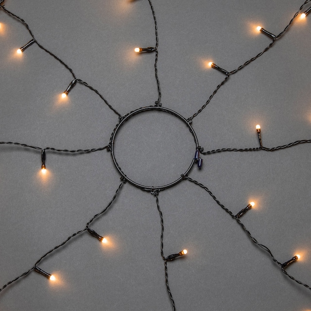 KONSTSMIDE LED-Baummantel »Weihnachtsdeko aussen, Christbaumschmuck, 8h  Timer, vormontiert«, Ring Ø 17, 8 Stränge à 70 bernsteinfarbene Dioden, mit  Glimmereffekt bequem online kaufen