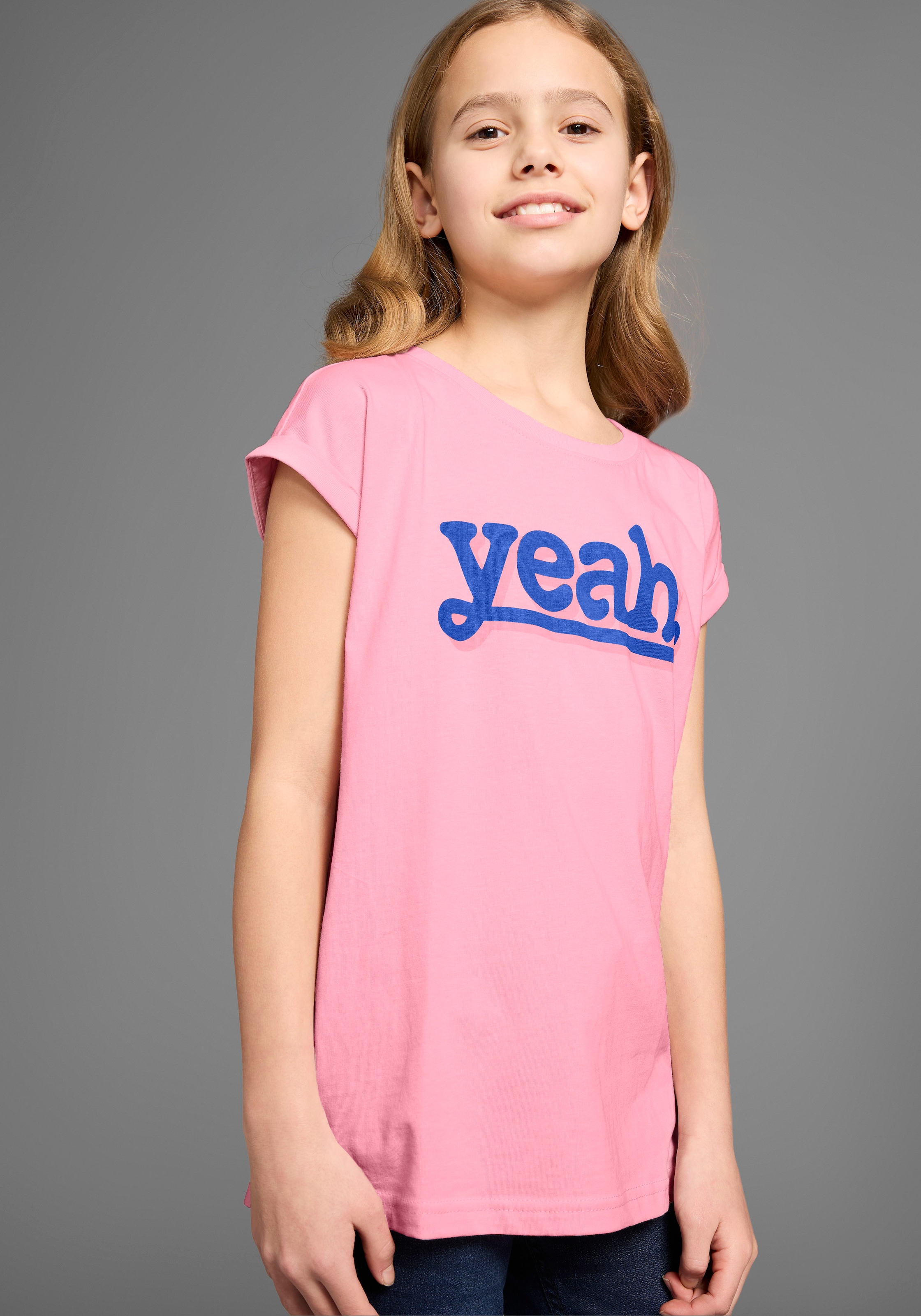 KIDSWORLD T-Shirt »Sprücheshirt mit überschnittener Schulter« T-Shirt "YEAH" print
