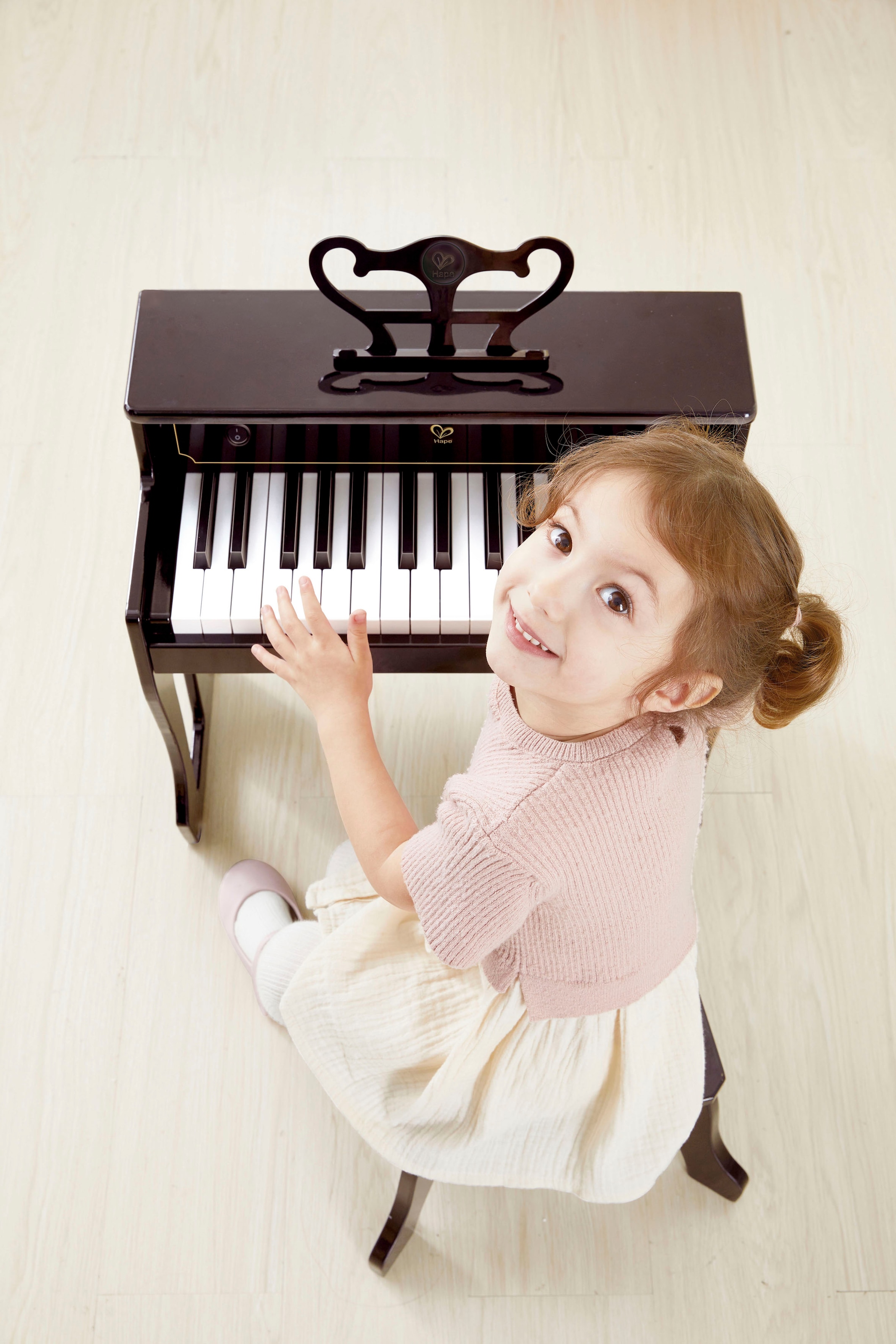 Hape Spielzeug-Musikinstrument »Klangvolles E-Piano«, inklusive Hocker; FSC®- schützt Wald - weltweit