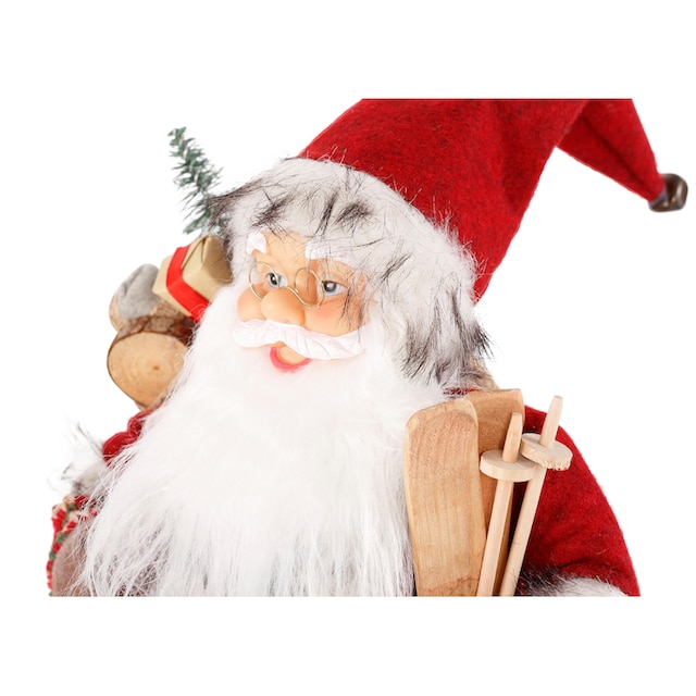 Arm unter und - Weihnachtsmann auf HOMECOLLECTION Weihnachtsdeko, mit dem »Santa Dekofigur, Rechnung Skiern Weihnachtsfigur Geschenken«, HOSSNER kaufen