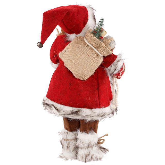 HOSSNER - HOMECOLLECTION Weihnachtsmann »Santa mit Skiern unter dem Arm und  Geschenken«, Weihnachtsdeko, Dekofigur, Weihnachtsfigur auf Rechnung kaufen
