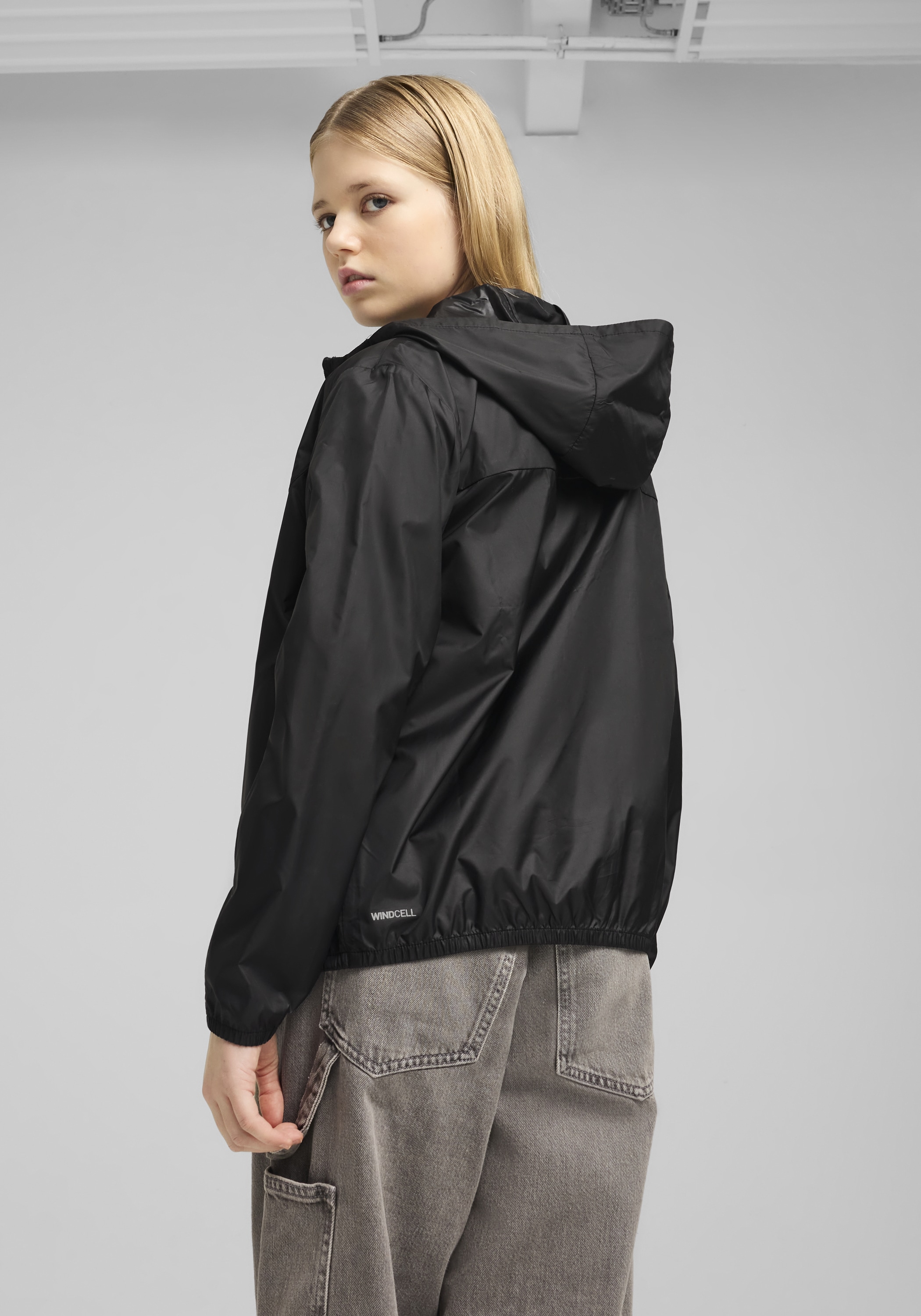 PUMA Windbreaker »ESS REGULAR WINDBREAKER« mit Kapuze für Jugendliche, mit Kapuze, mit Eingrifftasche