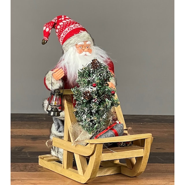 HOSSNER - HOMECOLLECTION Weihnachtsmann »Weihnachtsdeko mit Schlitten«,  Höhe ca. 32 cm auf Rechnung bestellen