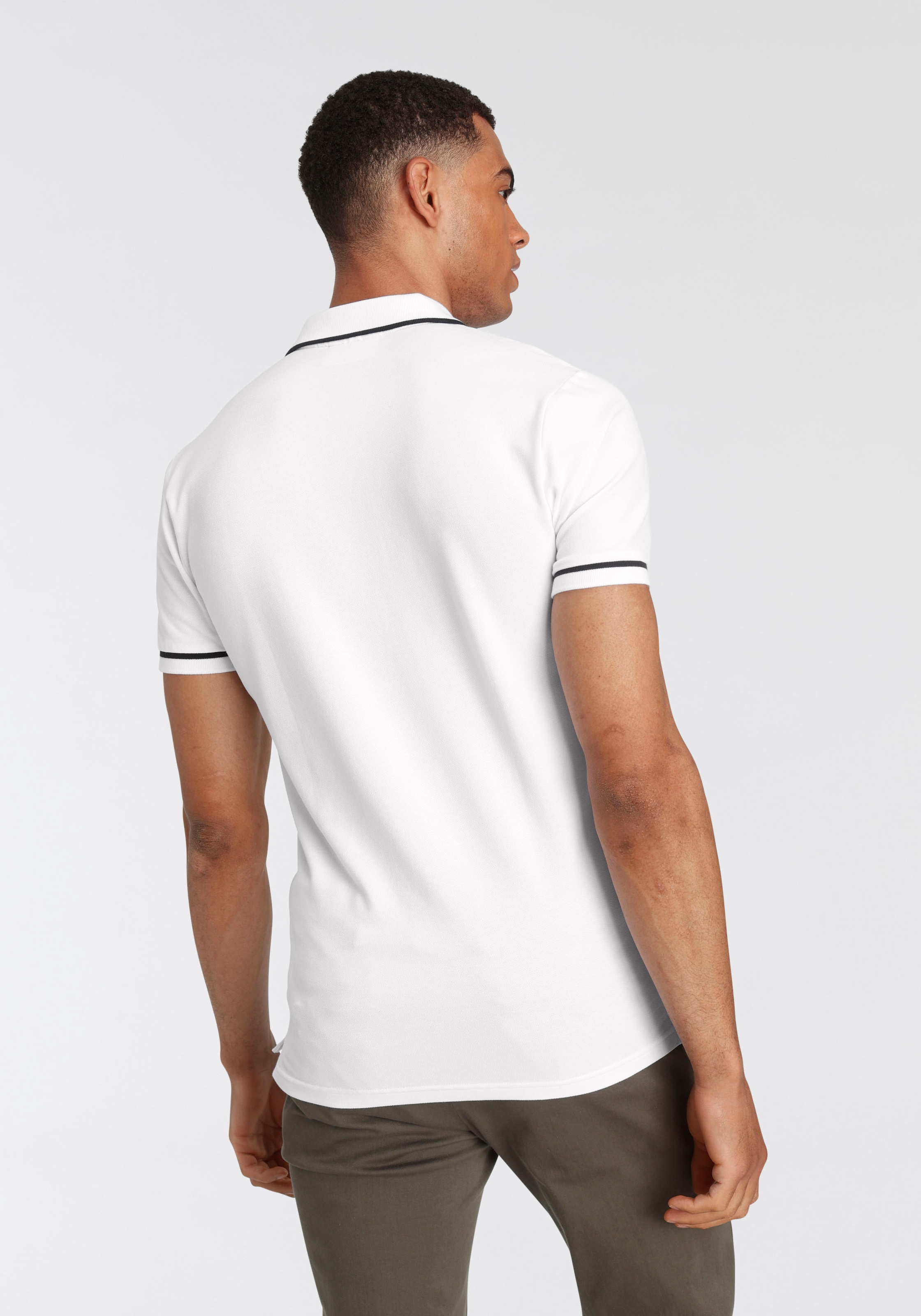 Calvin Klein Jeans Poloshirt »TIPPING SLIM POLO«, mit Logomarkenlabel bei ♕