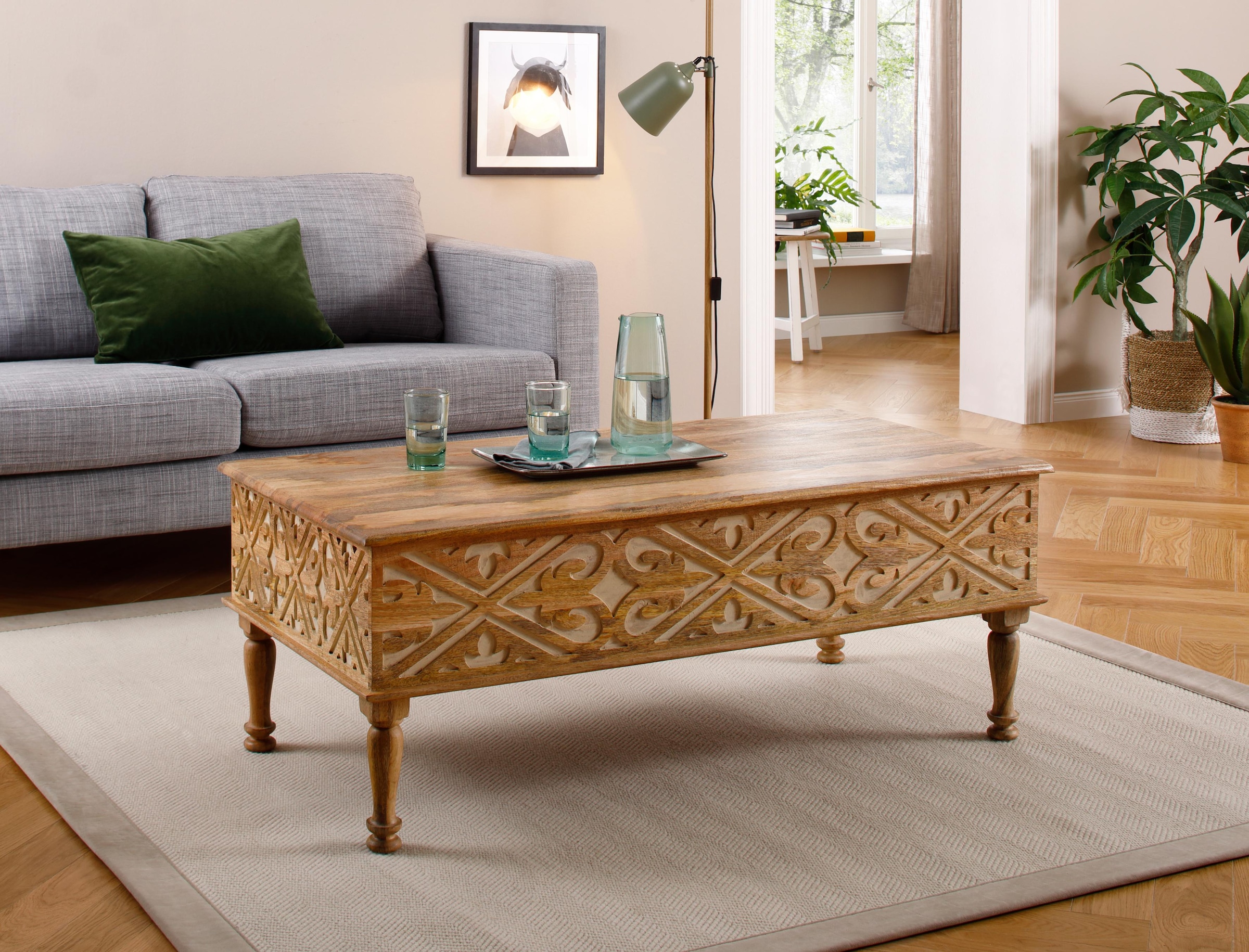 OTTO home Couchtisch "Spring" aus massivem Mangoholz mit detailreichen Schnitzereien, Breite 120 cm