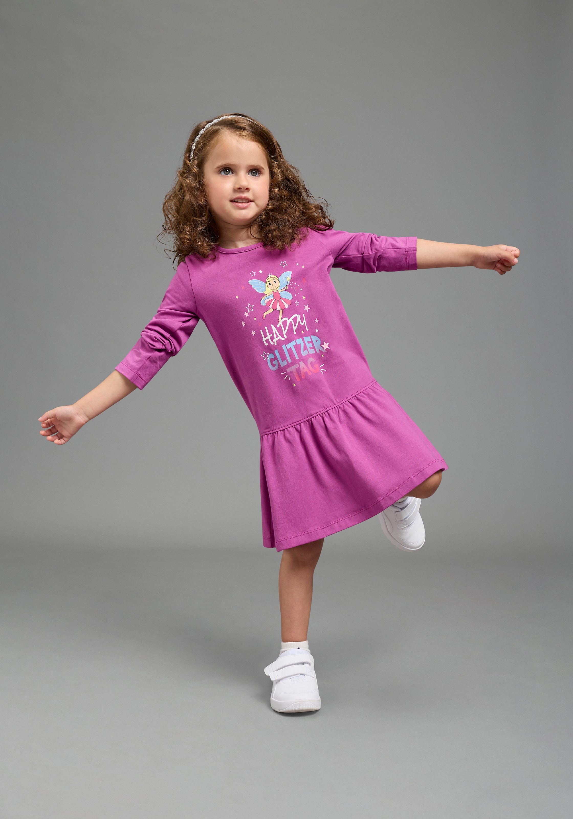 KIDSWORLD Jerseykleid »mit Spruch: HAPPY GLITZER TAG« Shirtkleid mit Feenprint, kniefreie Länge,  verspielter Look