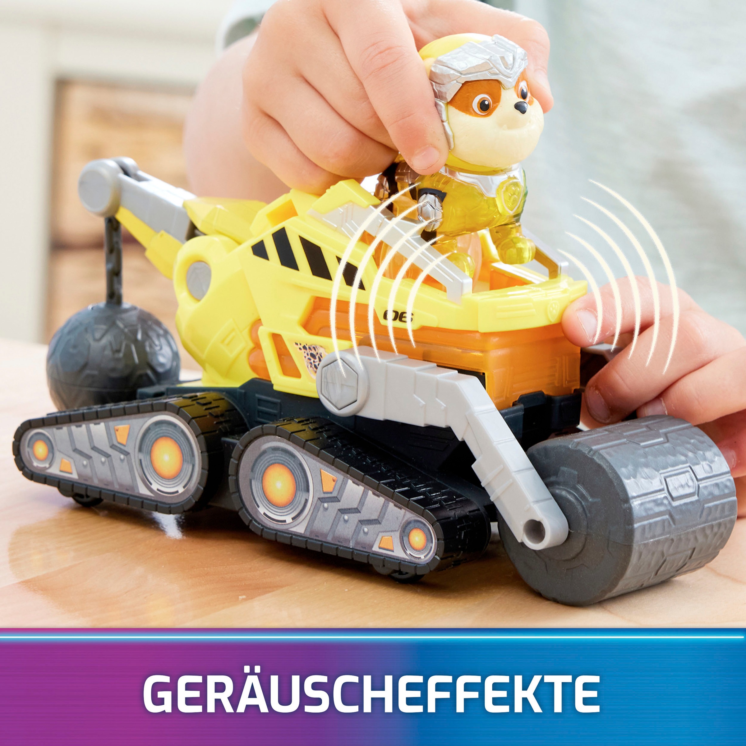 Spin Master Spielzeug-Auto »Paw Patrol - Movie II - Basic Themed Vehicles Rubble«, Baustellenfahrzeug mit Welpenfigur, Licht- und Soundeffekt