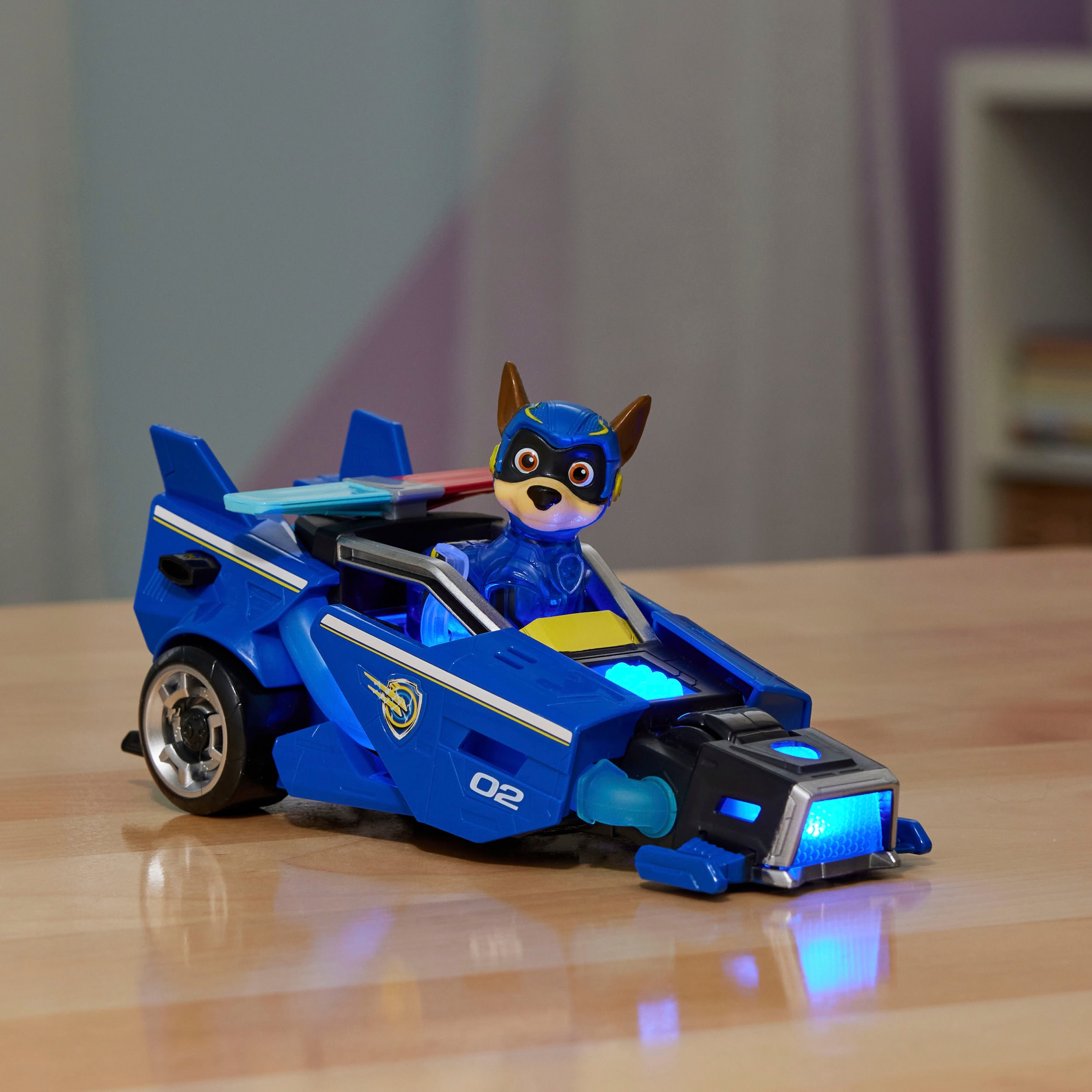 Spin Master Spielzeug-Auto »Paw Patrol - Movie II - Basic Themed Vehicles Chase«, Polizeiauto mit Welpenfigur, Licht- und Soundeffekt