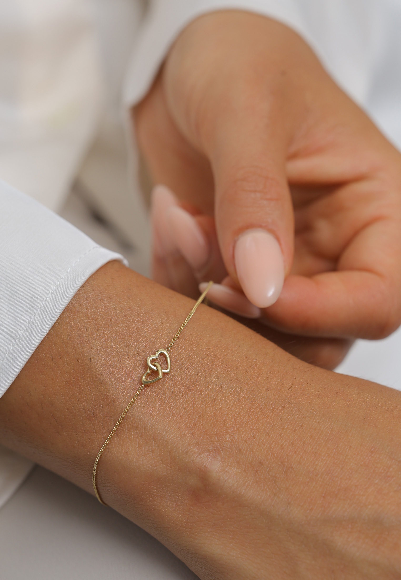 Elli Premium Armkette »Armband Herz Heart Verschlungen 585 Gelbgold«