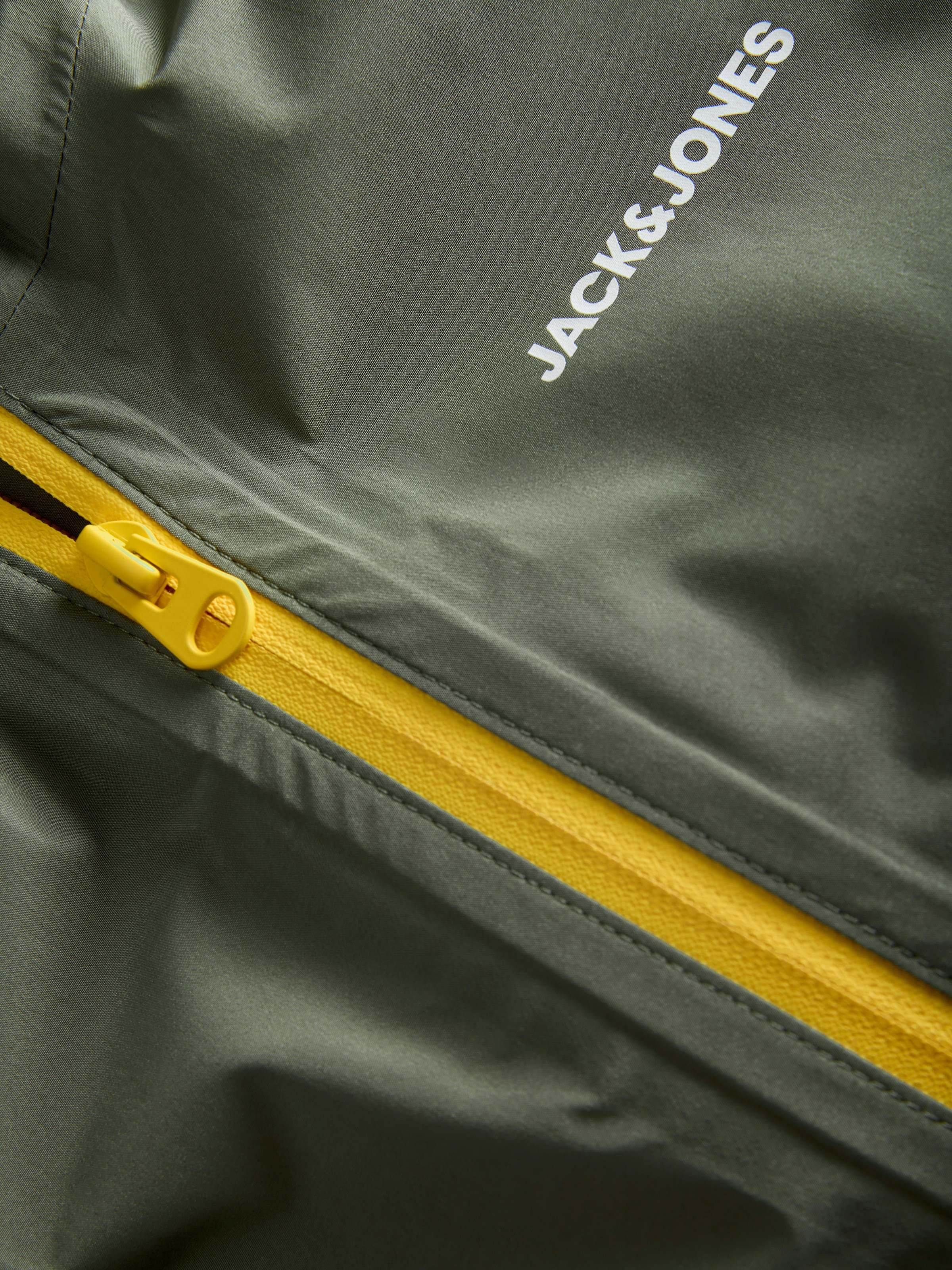 Jack & Jones Junior Regenjacke »JJEFLYNN RAIN JACKET SN JNR« mit Kapuze