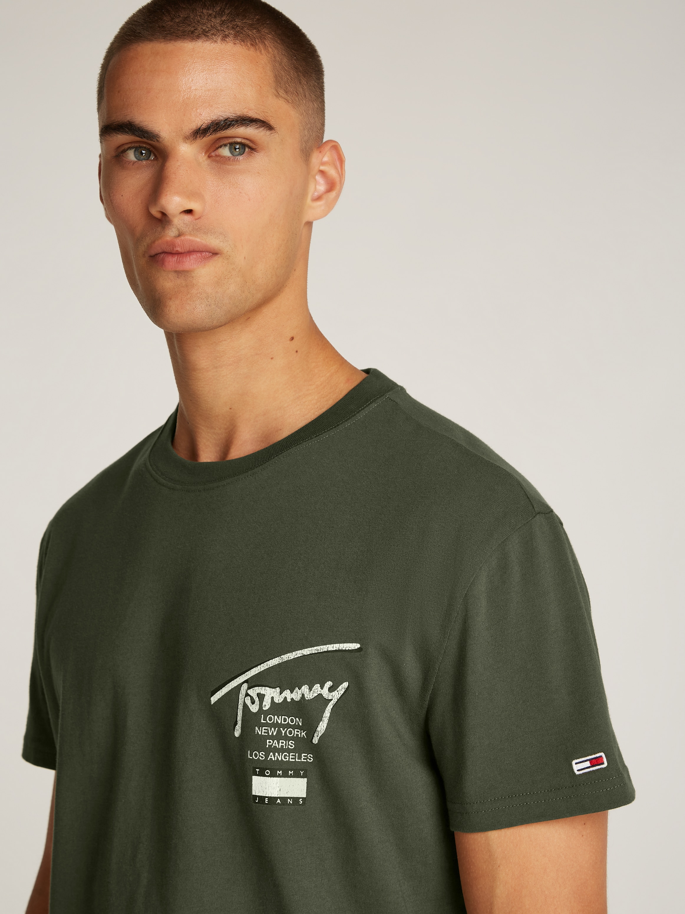 Tommy Jeans T-Shirt »TJM REG TOMMY SIGN CITY TEE EXT«, mit großem Logo am Rücken