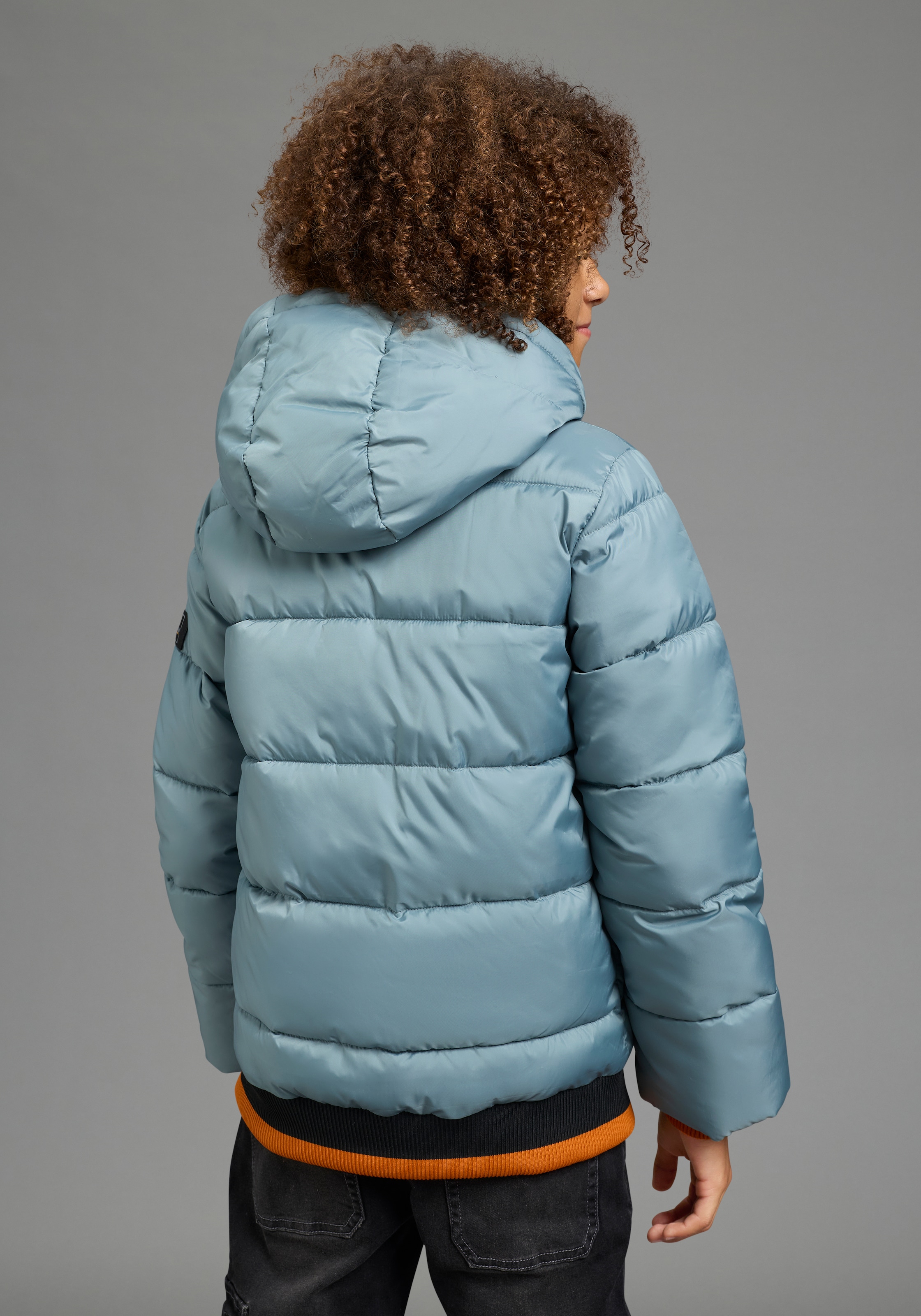 Bruno Banani Outdoorjacke »BRUNO BANANI Steppjacke mit modischen Rib-Bündchen« mit Kapuze Warme Jacke mit Kapuze, Fleecefutter, windabweisend, wasserabweisend
