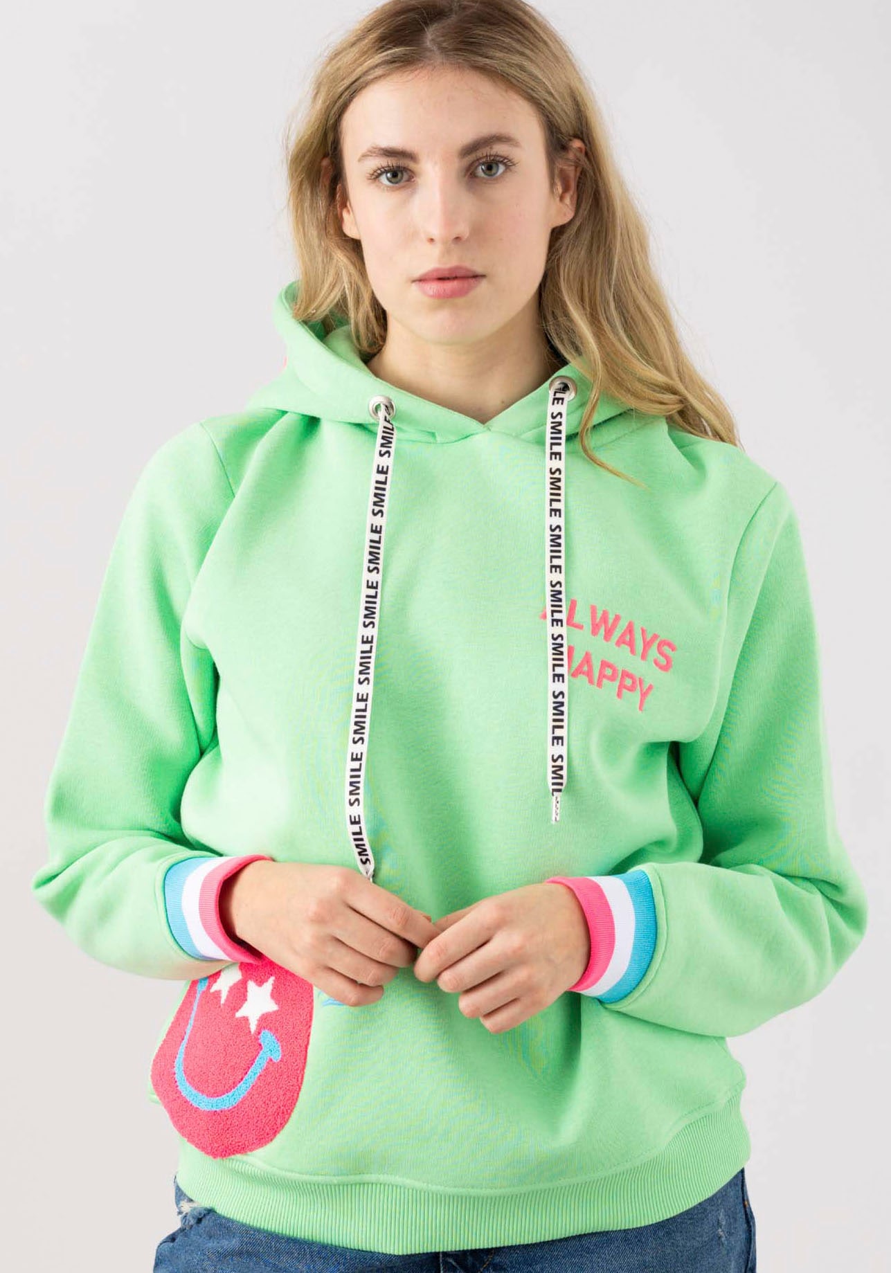 Zwillingsherz Hoodie »Always Happy«, mit Smiley Aufdruck aus Frottee und Neon Details