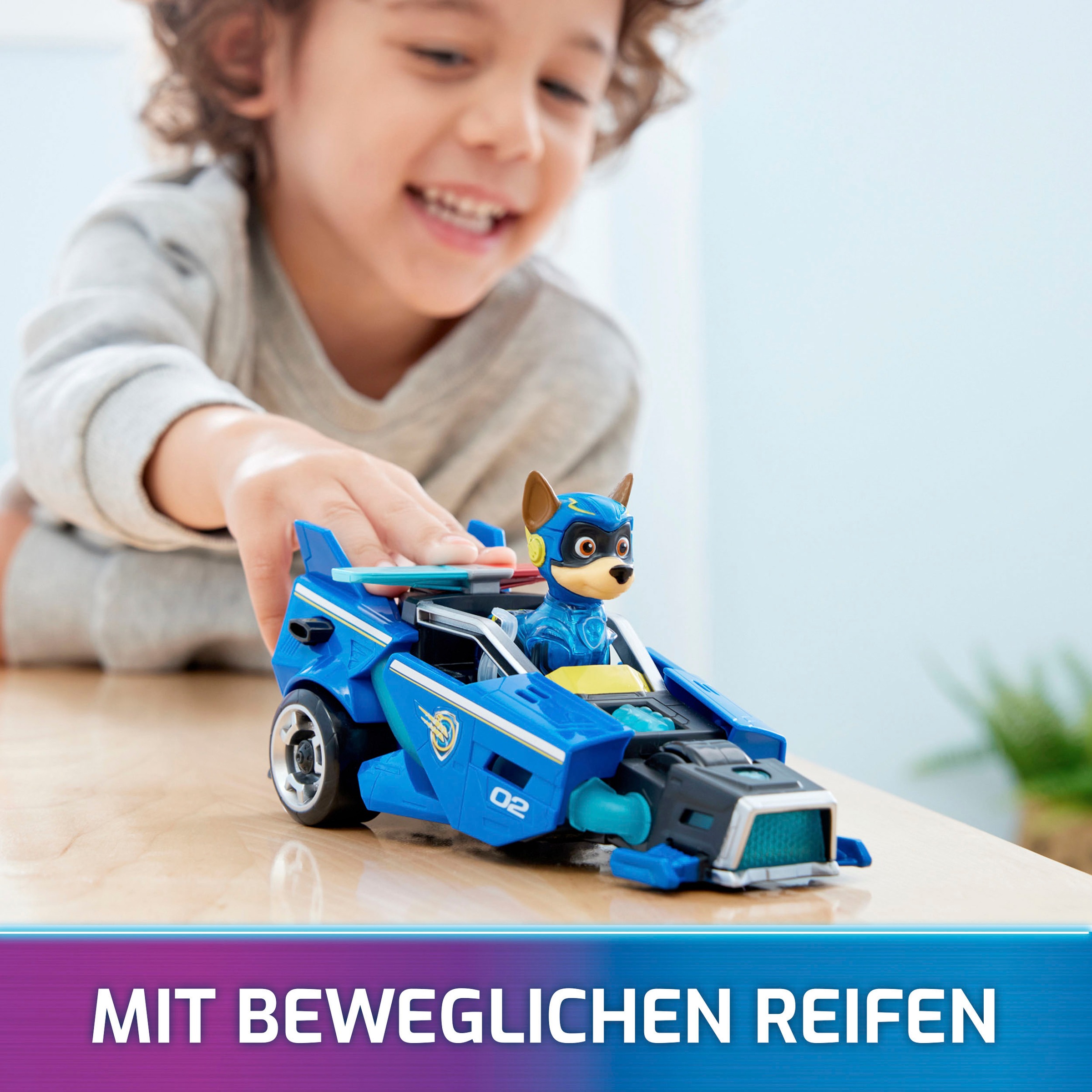 Spin Master Spielzeug-Auto »Paw Patrol - Movie II - Basic Themed Vehicles Chase«, Polizeiauto mit Welpenfigur, Licht- und Soundeffekt