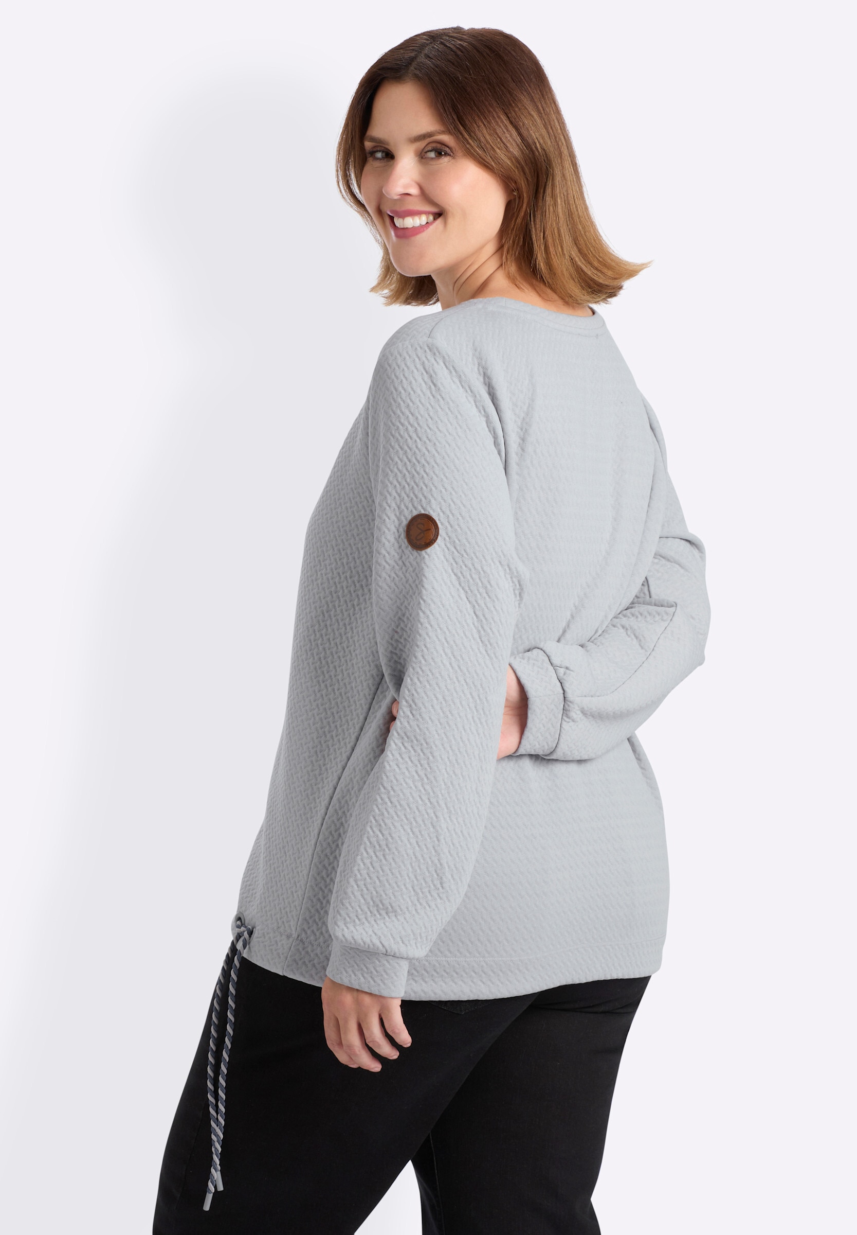 Sheego Sweatshirt »Sweatshirt Sweatshirt mit Ösen und gedrehtem Garn«
