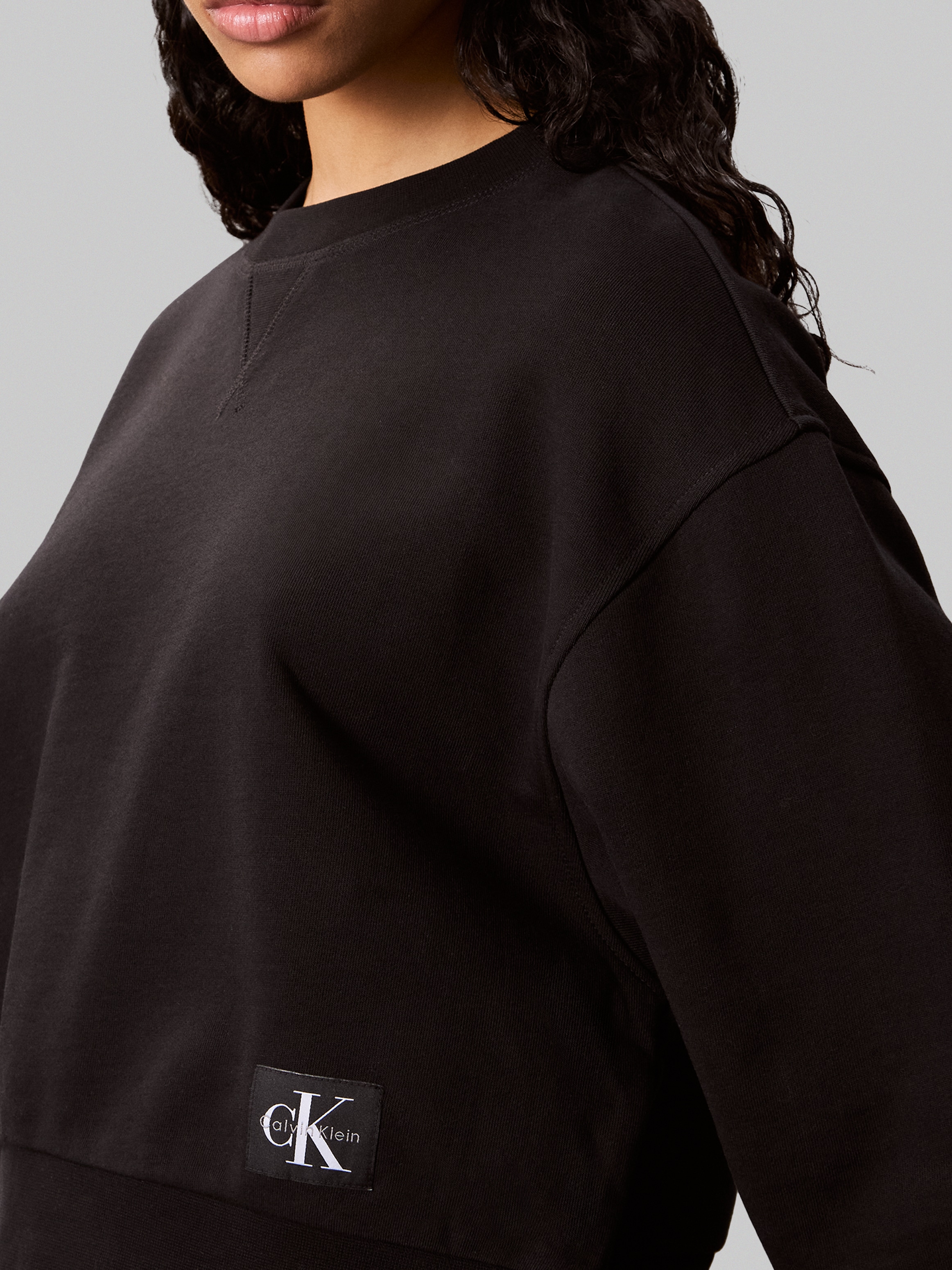 Calvin Klein Jeans Sweatshirt »FRENCH TERRY WOVEN LABEL CREW«, Regular fit mit Rundhalsausschnitt
