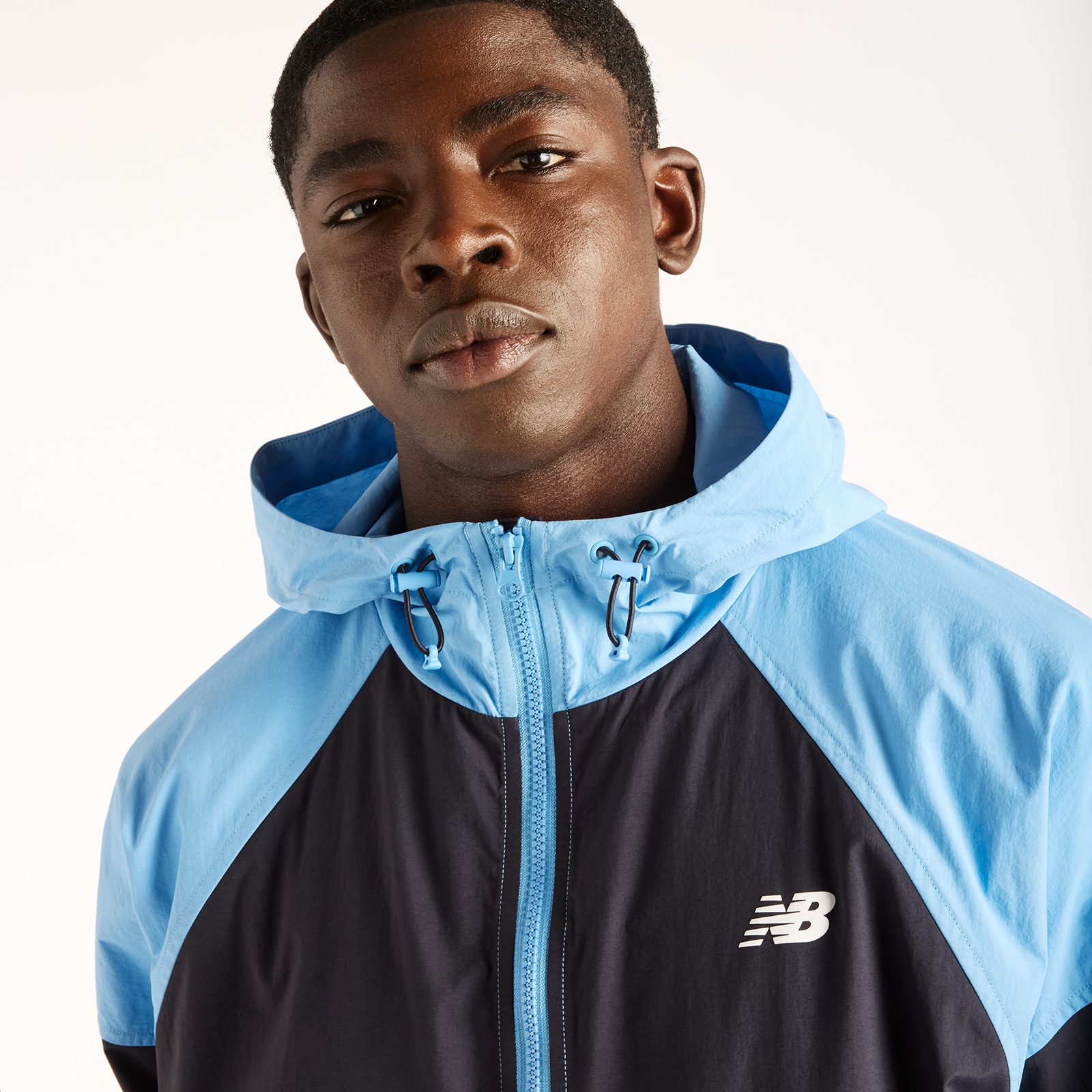 New Balance Windbreaker »SPORT ESSENTIALS FZ JACKET« mit Kapuze Oversized geschnittene Windjacke, wasserabweisend
