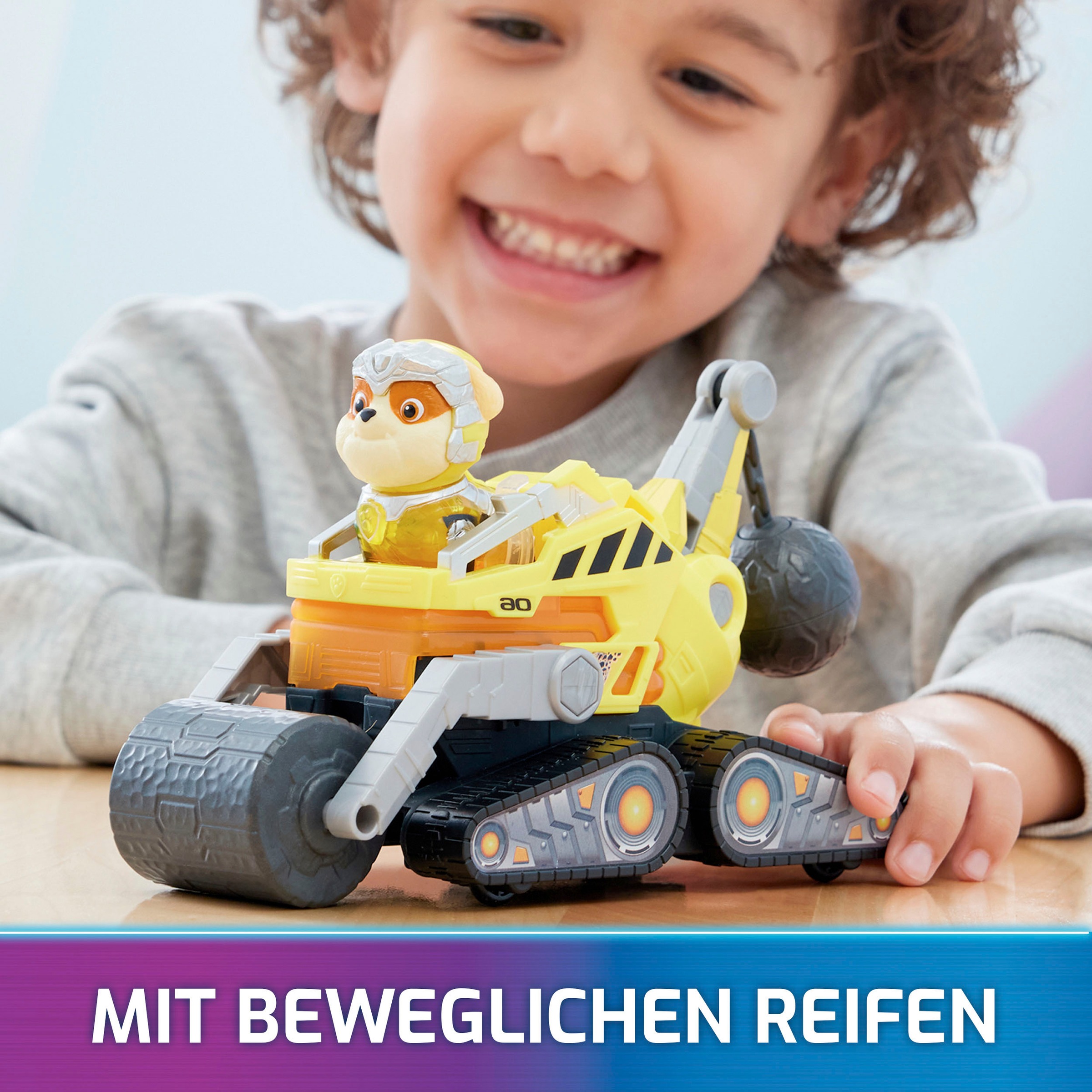 Spin Master Spielzeug-Auto »Paw Patrol - Movie II - Basic Themed Vehicles Rubble«, Baustellenfahrzeug mit Welpenfigur, Licht- und Soundeffekt