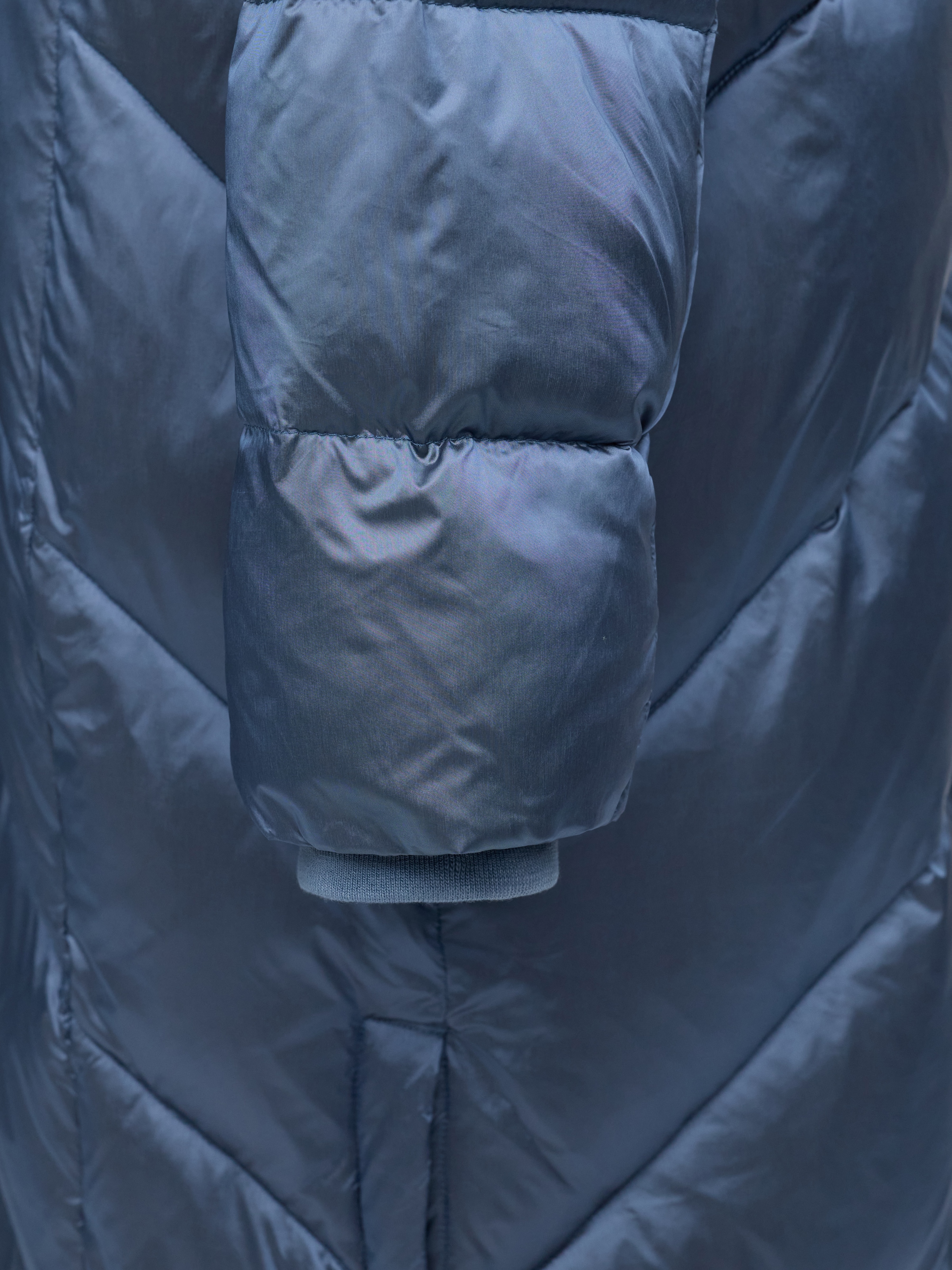 MANISA Steppmantel , mit Stehkragen und fester Kapuze und dekorativen Strickbändern
