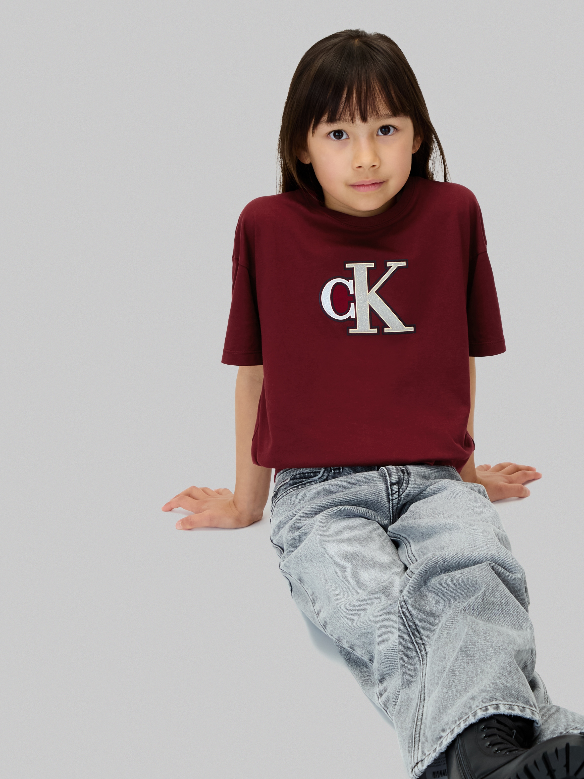 Calvin Klein Jeans T-Shirt »FESTIVE GRAPHIC SS T-SHIRT« für Kinder bis 16 Jahre, Glitzer-Druck
