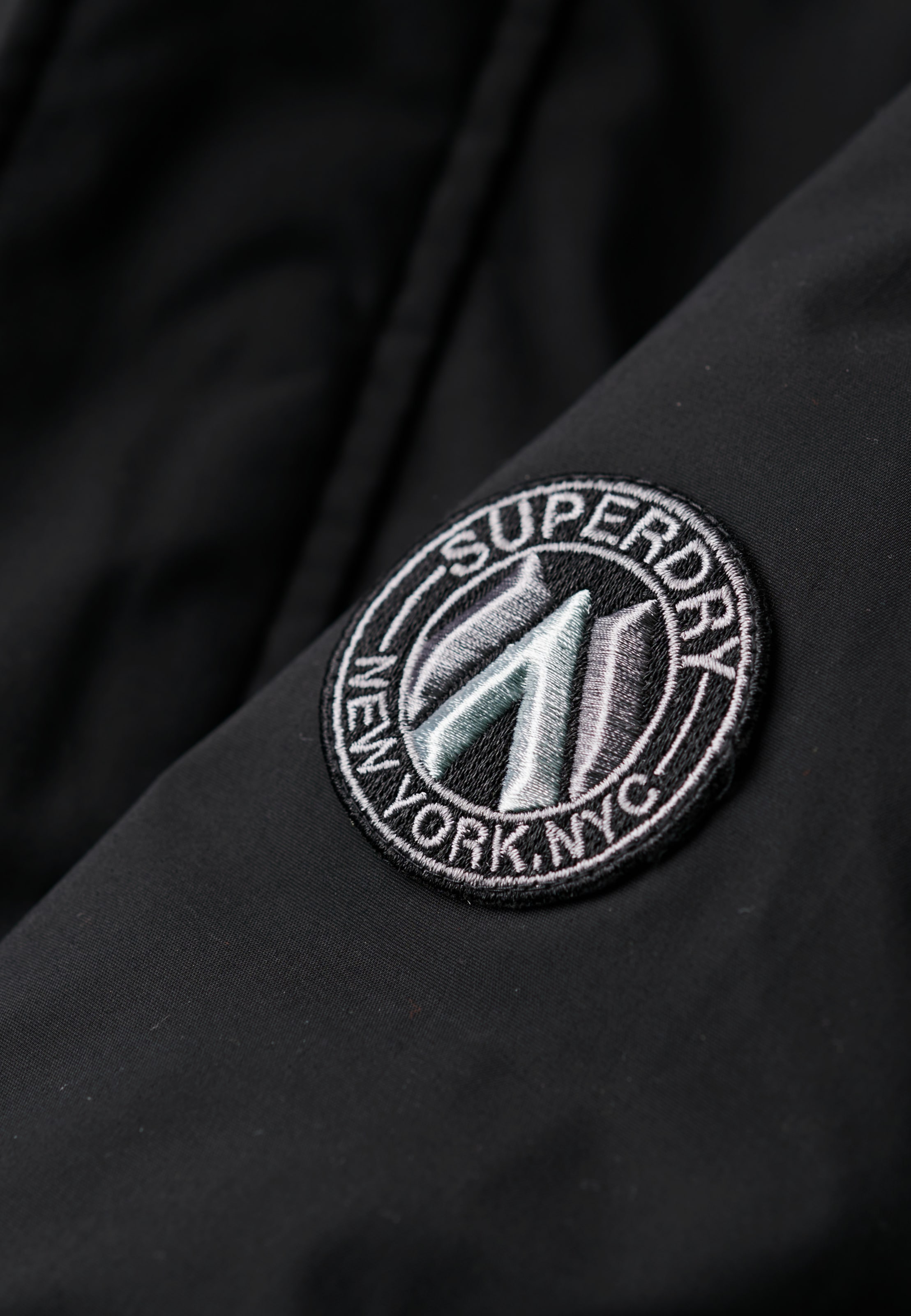 Superdry Bomberjacke »CITY PADDED BOMBER JACKET« ohne Kapuze Materialmix, regular fit